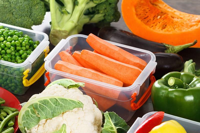 Assorted vegetables in plastic containers